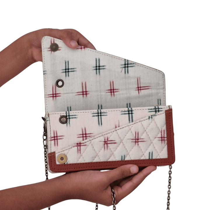 Geometric prints on Ikkat Cotton Fabric clutch with leather border